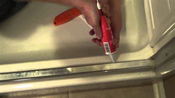 How do you caulk a corner shower stall?