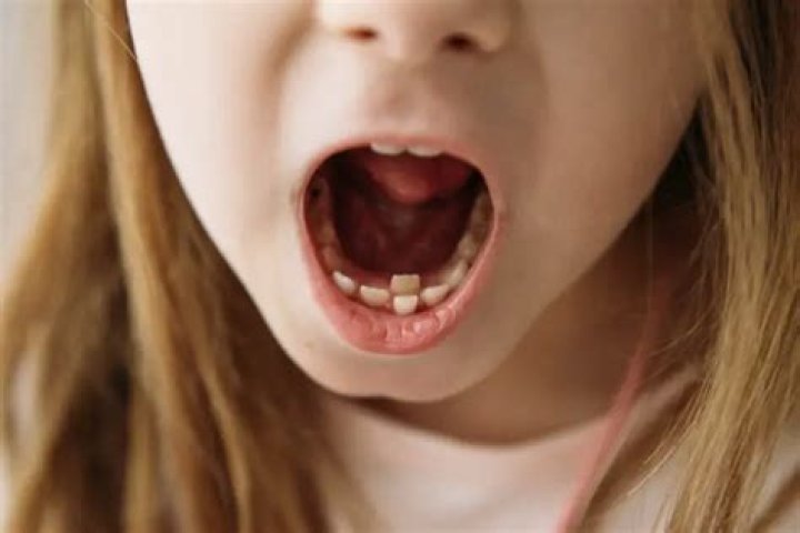 Why is my child's tooth pink?
