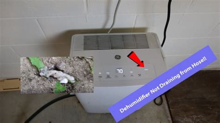 Why is my dehumidifier not draining through the drain hose properly?